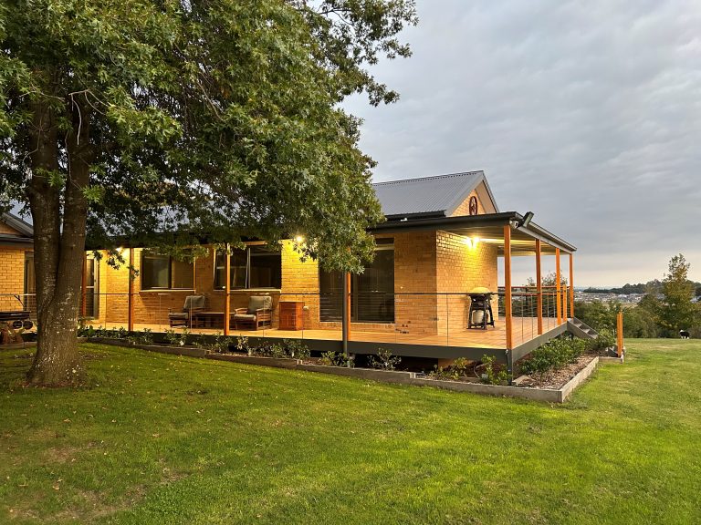 Extension project for a residential home surrounded by a lawn