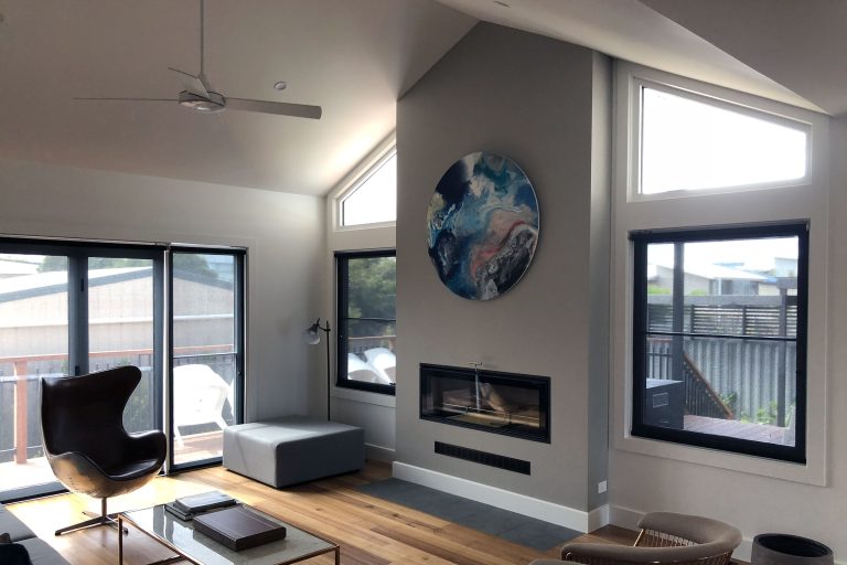 Room with open space and feature wall and fireplace build