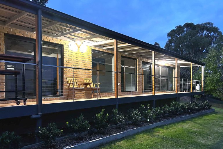 large wooden veranda porch with benches