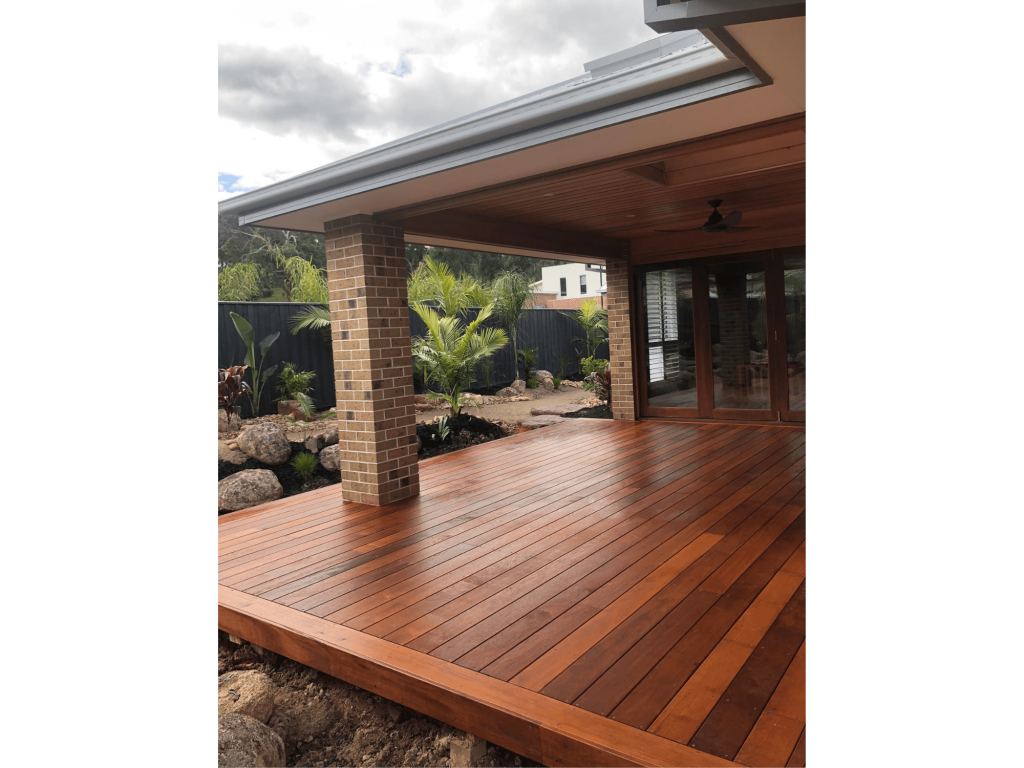 Back verandah in Officer with brick columns and wooden decking