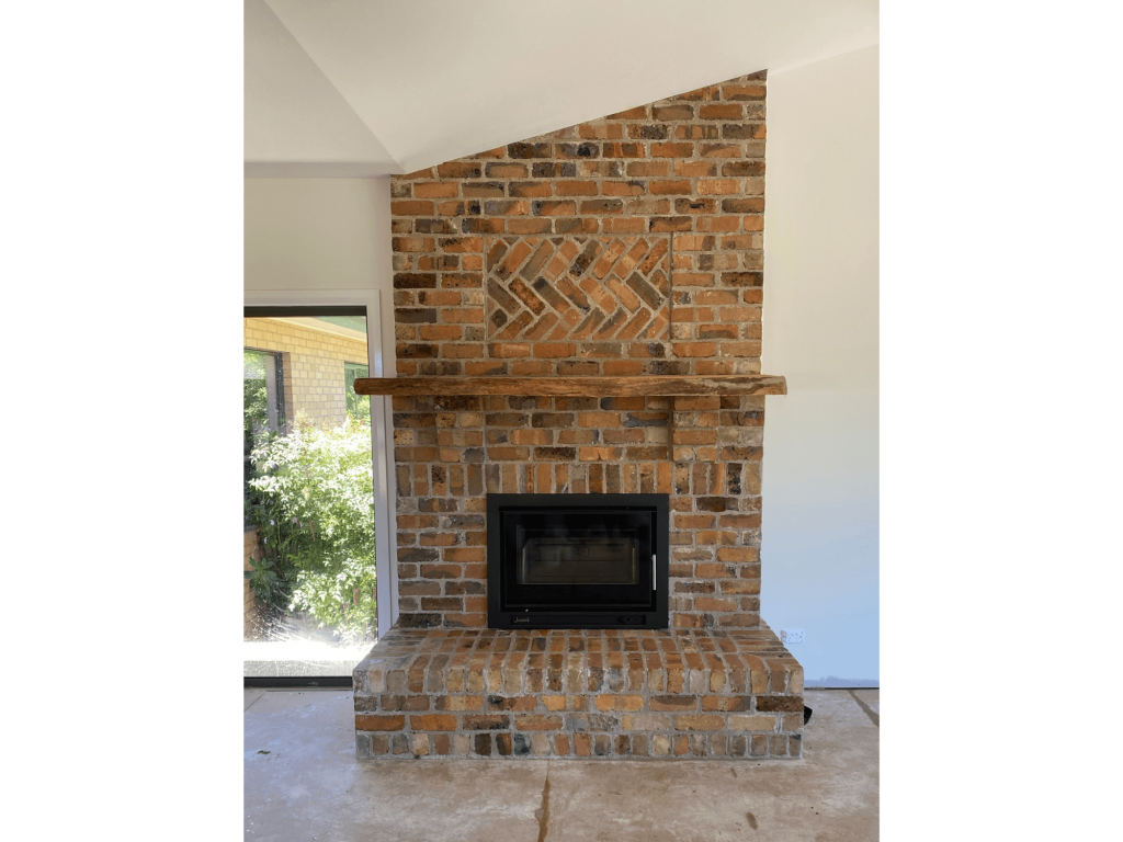 Handmade brick fireplace setting renovation Silverleaf Homes