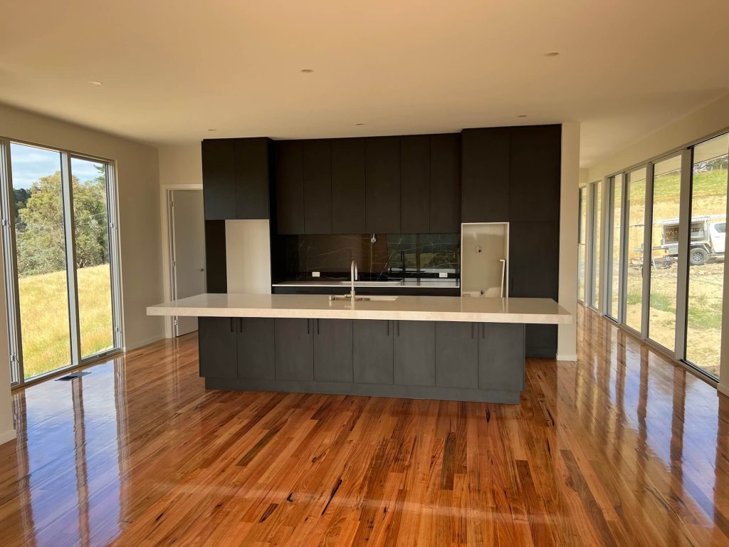 Narre Warren kitchen open space with glass windows surrounds to let natural light and warmth in during winter