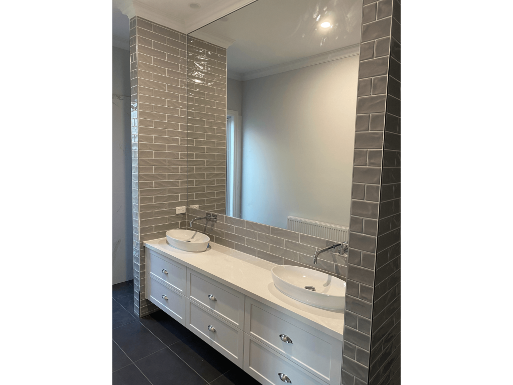 Pascoe Vale Victoria bathroom renovation with silver glossy tiles and white couple basins