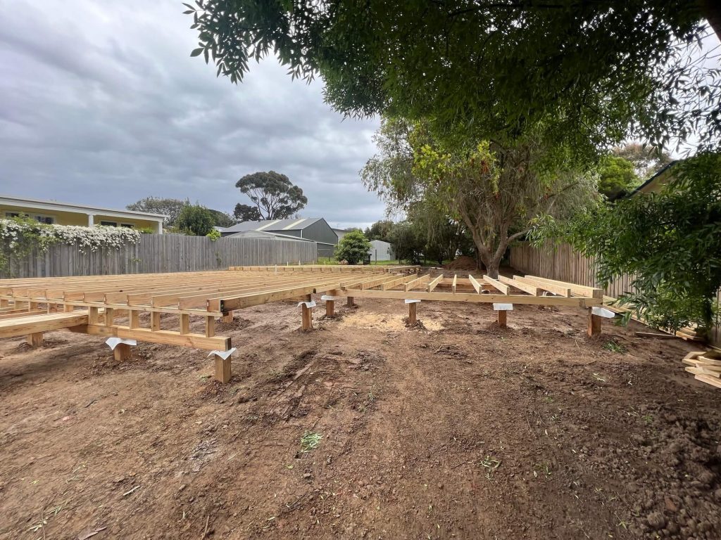 Phillip Island home project build photo with wooden frames to begin project in early days