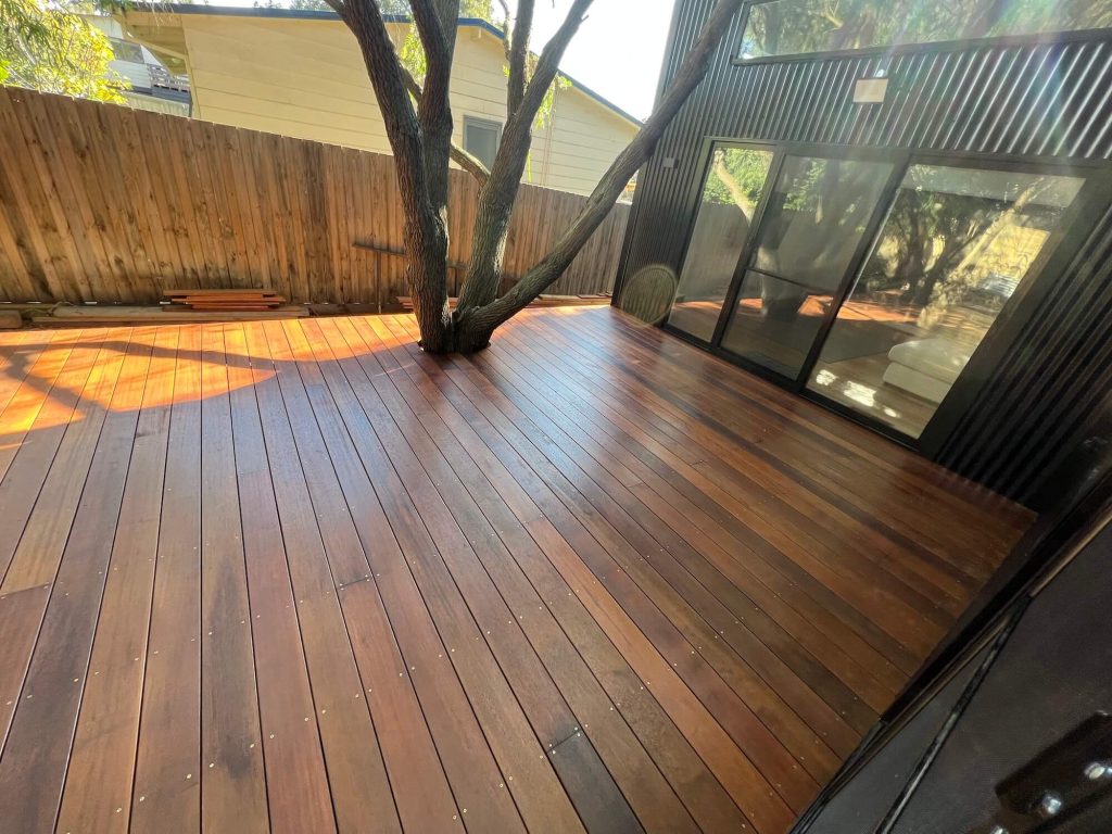 Phillip Island home reno incorporates natures elements with tree intact around wooden deck
