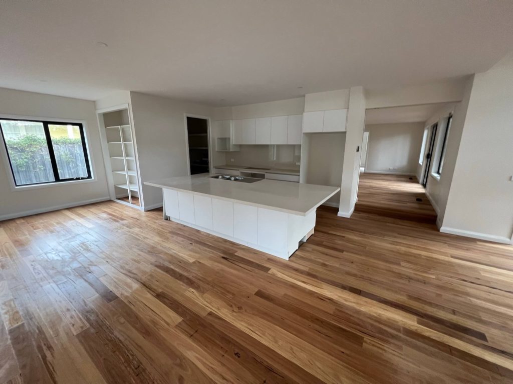Wide open living room space and kitchen to provide ample movement and comfort for Victorian home build