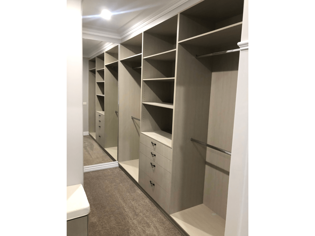 Wide open space Officer walk in bedroom closet with draws and storage space